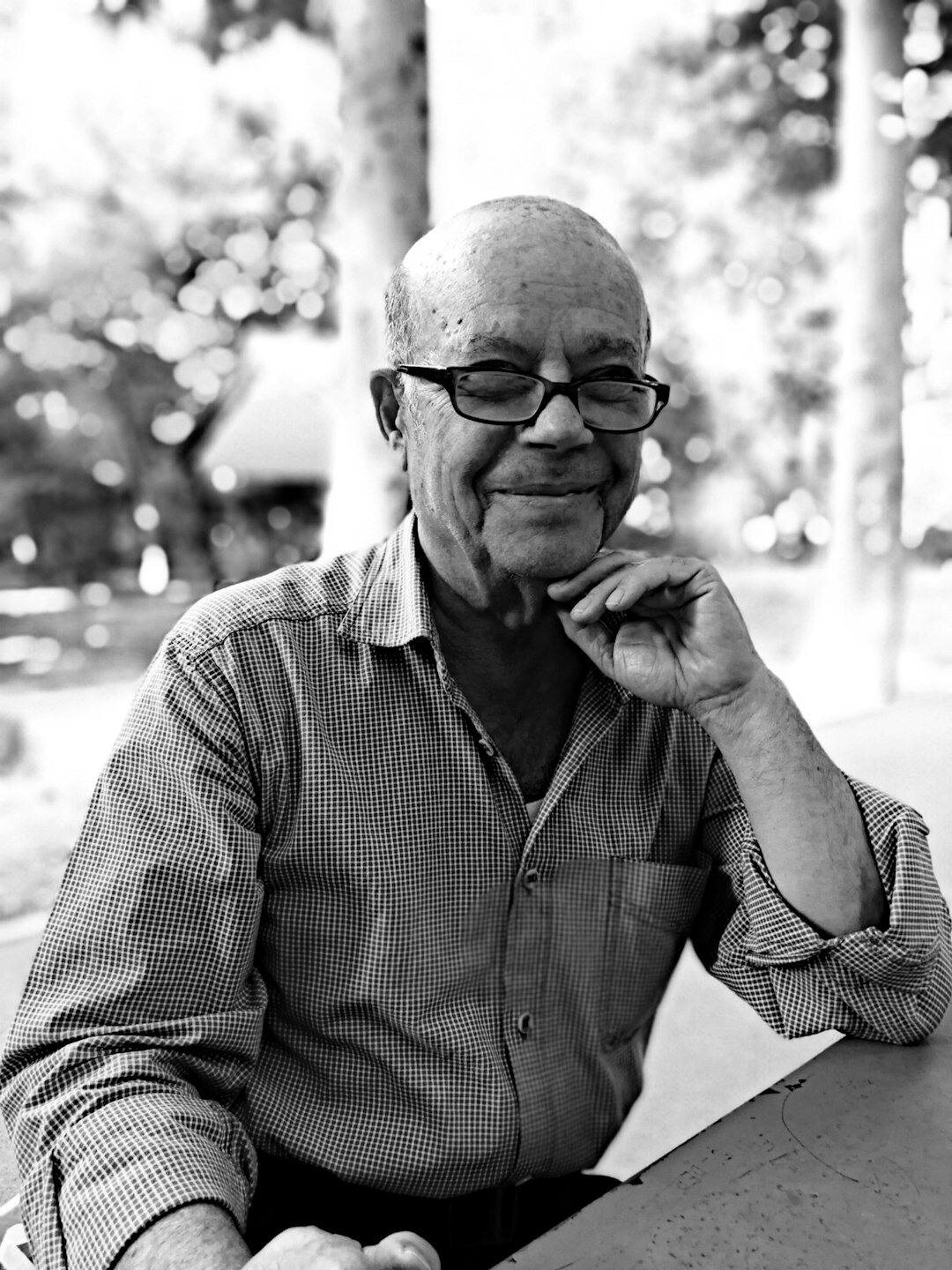 Portrait of an elderly man with glasses smiling